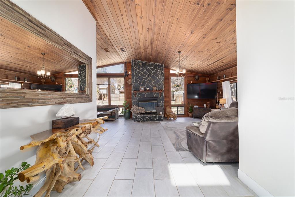 3510 Southwest 5th Court Ocala, FL 34471 - Photo 3 of 44 a living room with furniture and a fireplace
