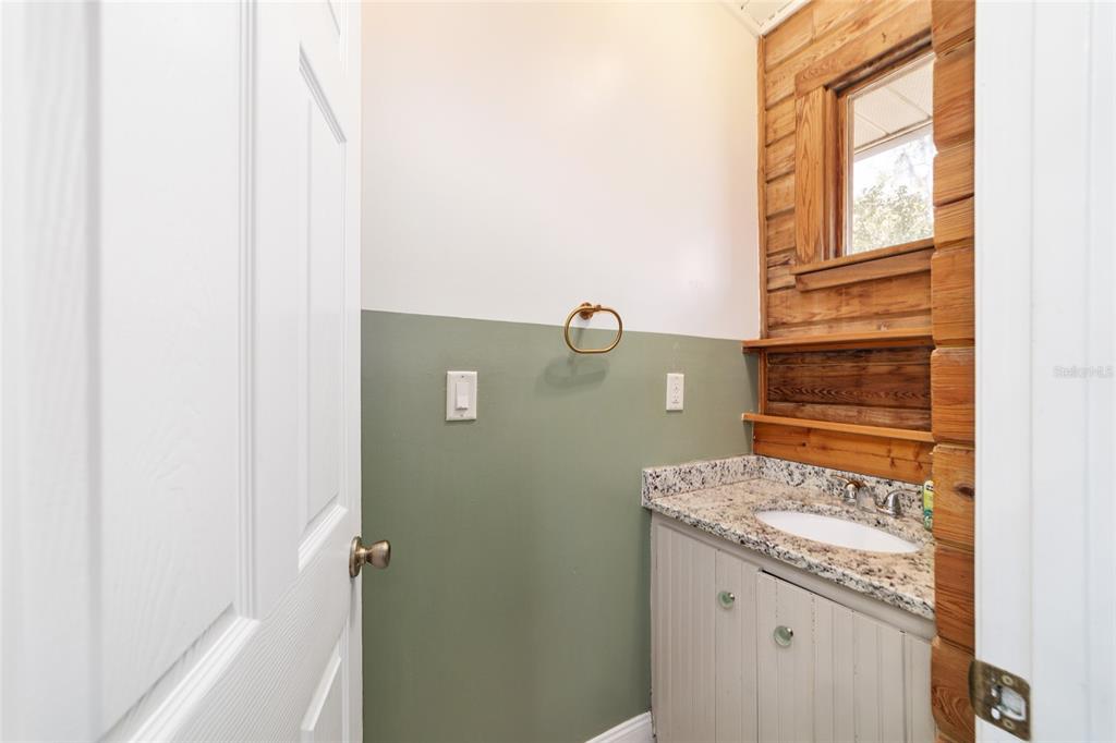 3510 Southwest 5th Court Ocala, FL 34471 - Photo 33 of 44 a bathroom with a granite countertop window and a sink