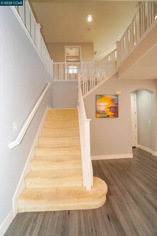 a view of a kitchen with large windows