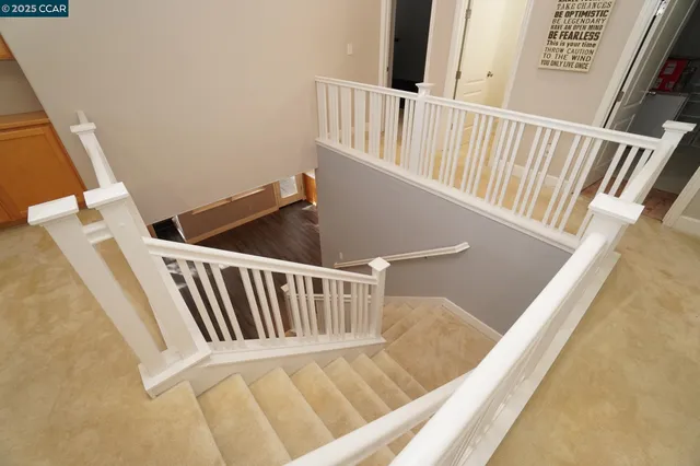 a white toilet sitting next to a bath tub