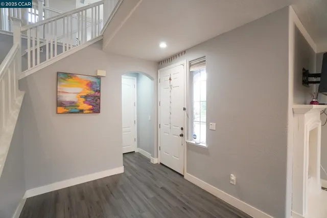 a view of entryway with wooden floor