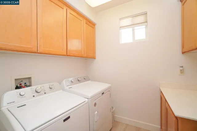 a spacious bedroom with a bed and a mirror