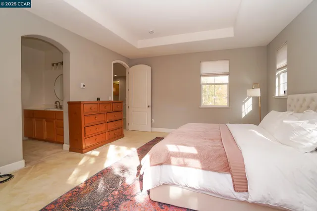 a bathroom with a double vanity sink mirror and a bathtub
