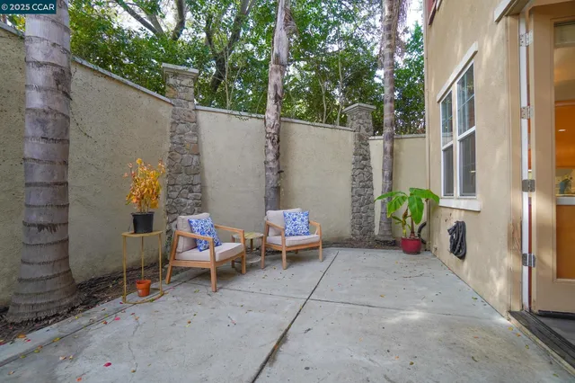 a backyard of a house with outdoor seating