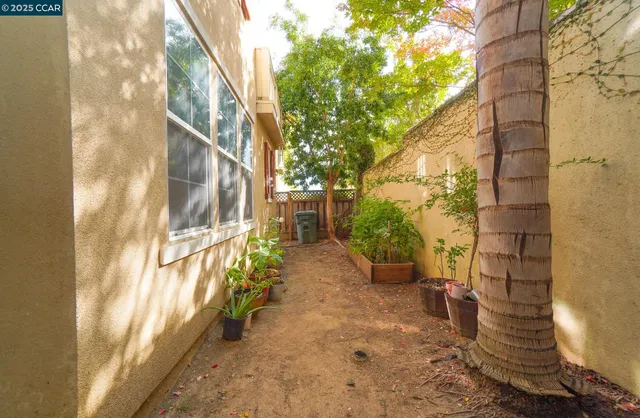 a view of a house with backyard porch and sitting area