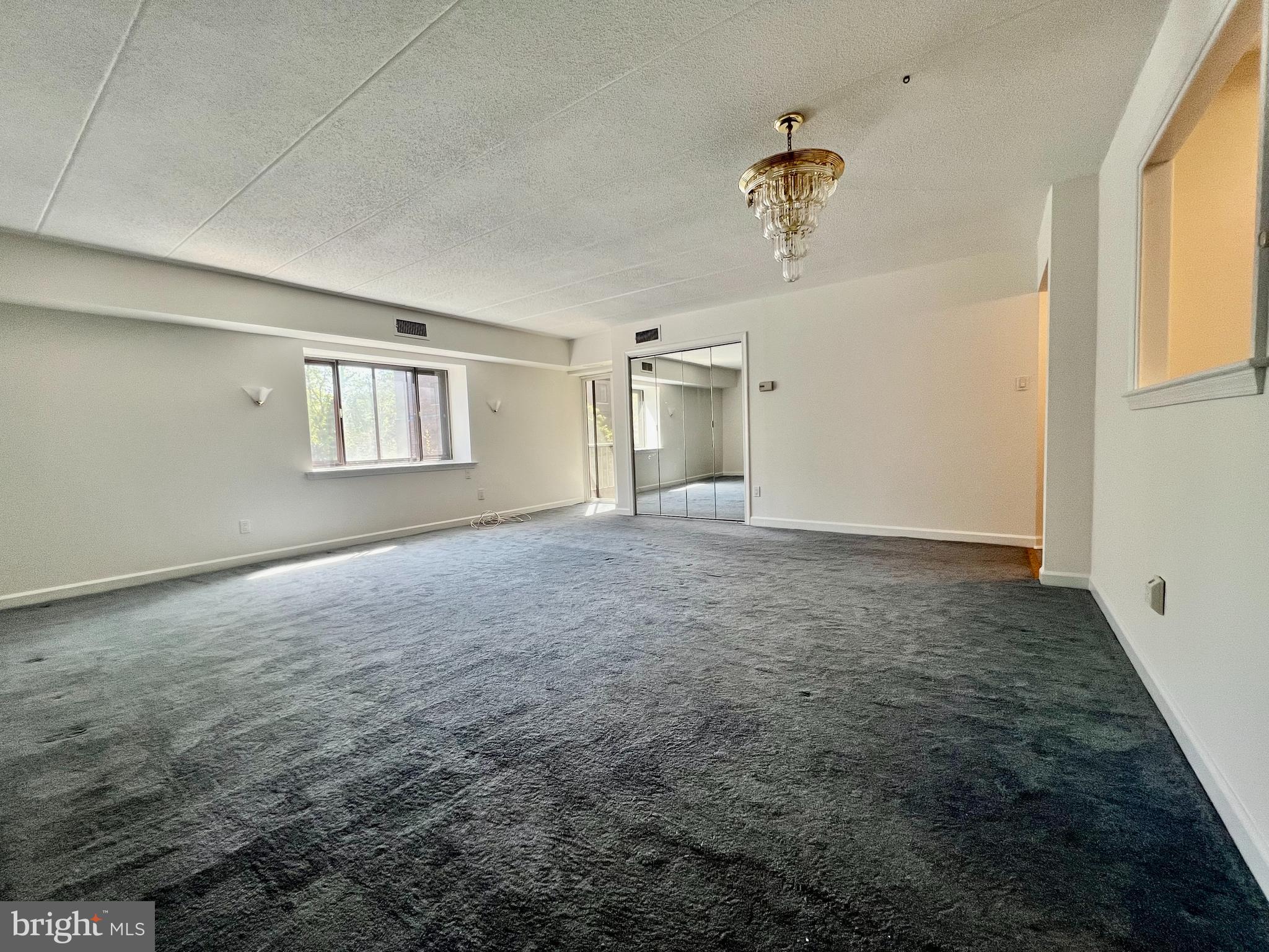 1219 West Wynnewood Road, Unit 206 Wynnewood, PA 19096 - Photo 9 of 24 Living/Dining Area with Balcony Access