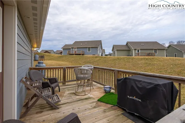 a view of houses with outdoor space and deck
