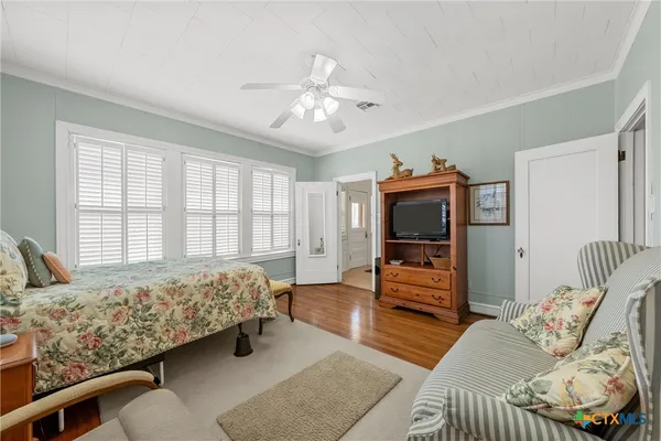 a bedroom with furniture and a window