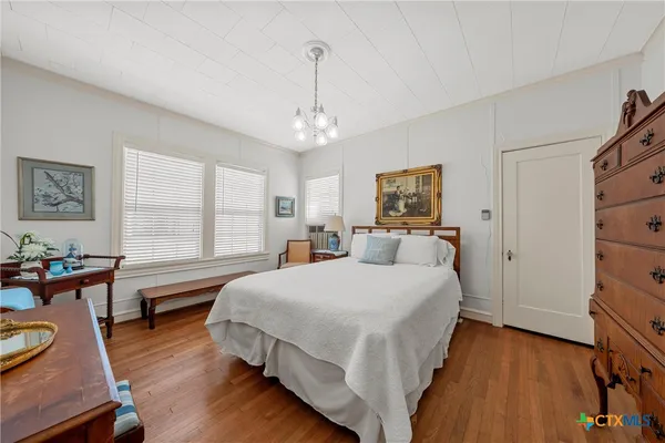 a bedroom with bed and window