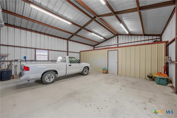 a view of parking garage with cars