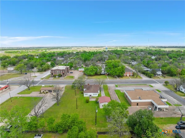 an aerial view of a house with a garden