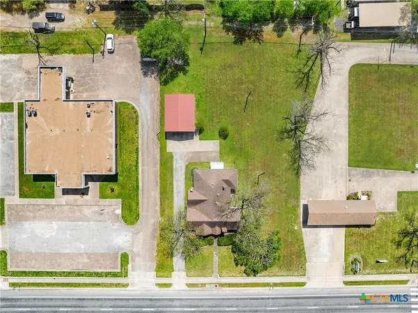 an aerial view of residential house with outdoor space and swimming pool