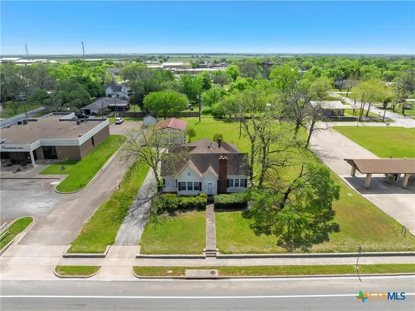an aerial view of a house with a garden