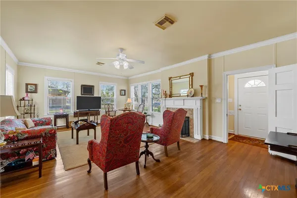 a view of a livingroom with furniture and a workspace