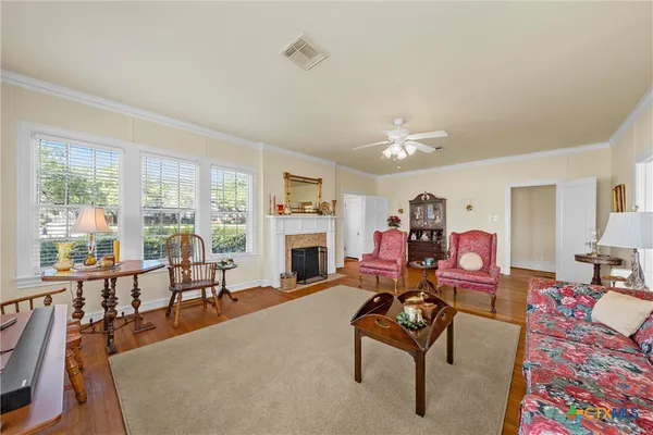 a living room with furniture and a fireplace