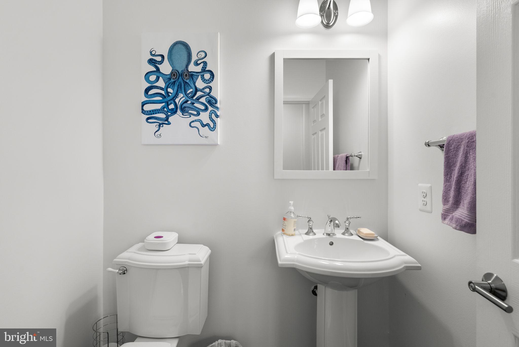 1222 Gaither Road Rockville, MD 20850 - Photo 15 of 42 a bathroom with a sink mirror and toilet