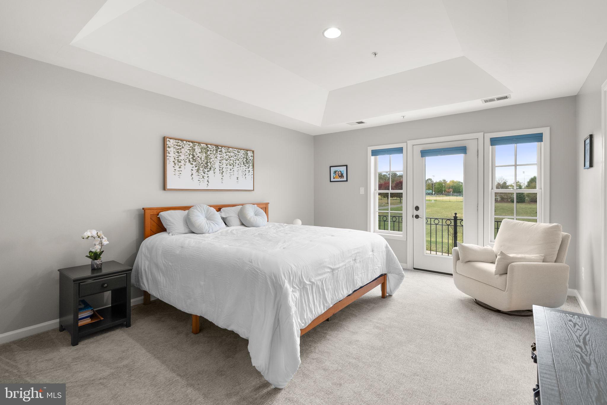 1222 Gaither Road Rockville, MD 20850 - Photo 16 of 42 a bed room with a bed and a couch