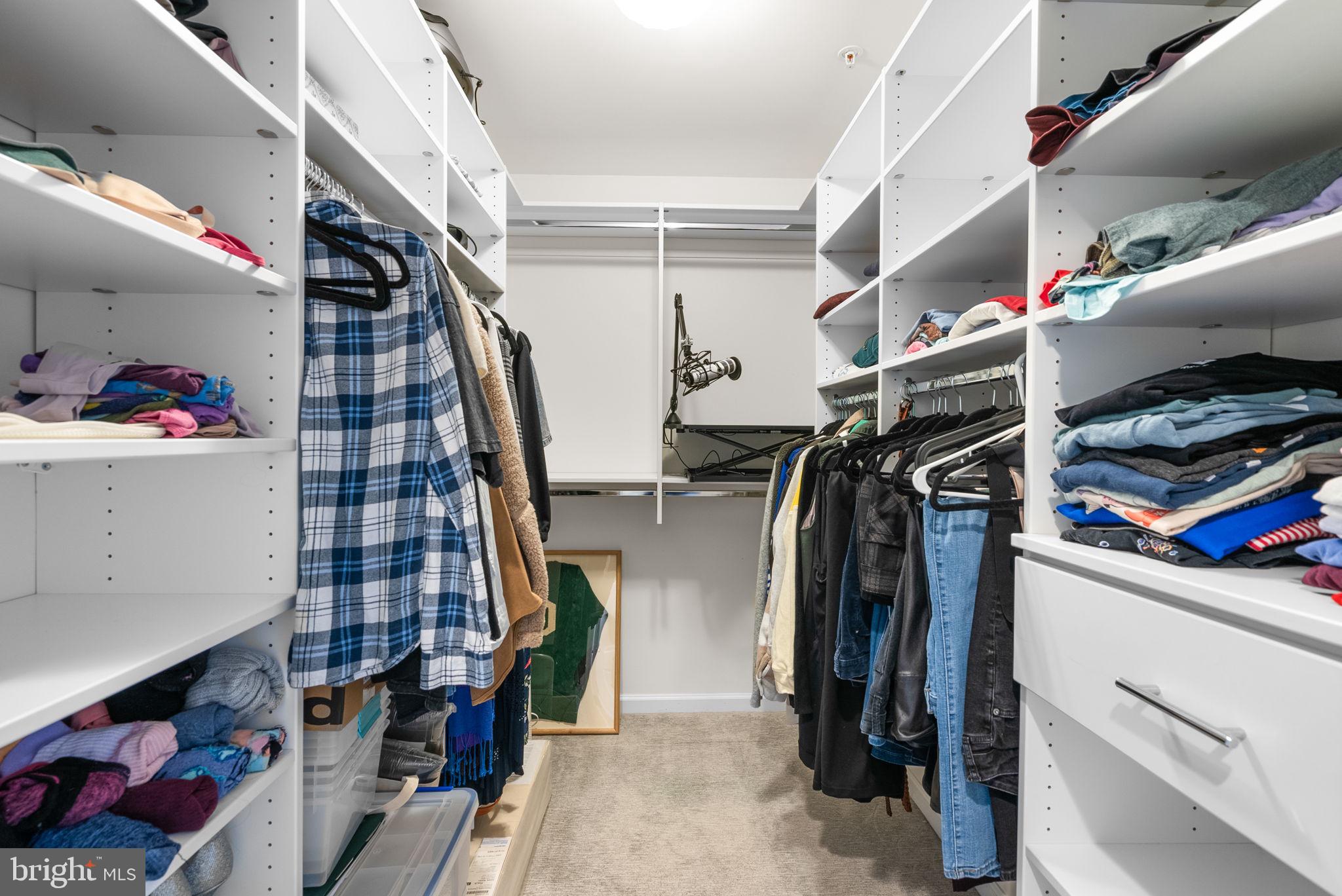 1222 Gaither Road Rockville, MD 20850 - Photo 20 of 42 a view of walk in closet with clothes and shoes