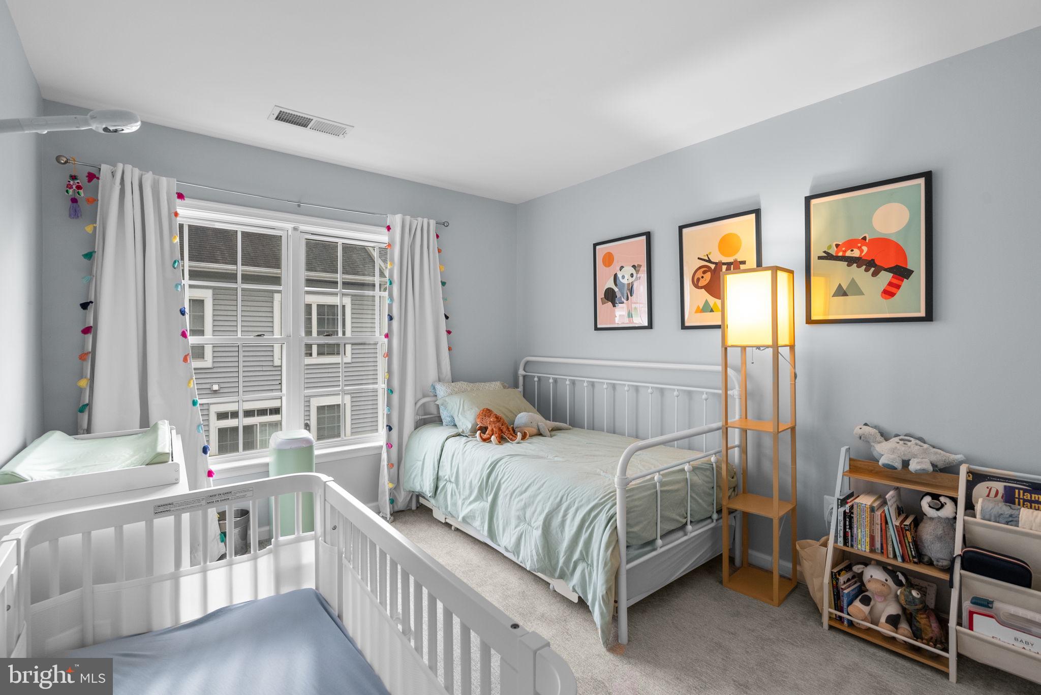 1222 Gaither Road Rockville, MD 20850 - Photo 22 of 42 a bedroom with furniture and a window