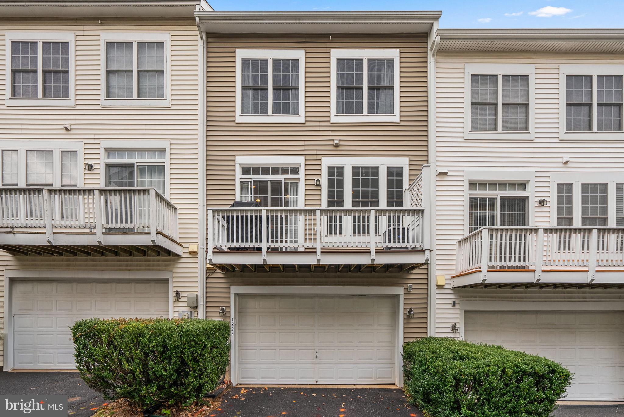 1222 Gaither Road Rockville, MD 20850 - Photo 28 of 42 a front view of a house with balcony