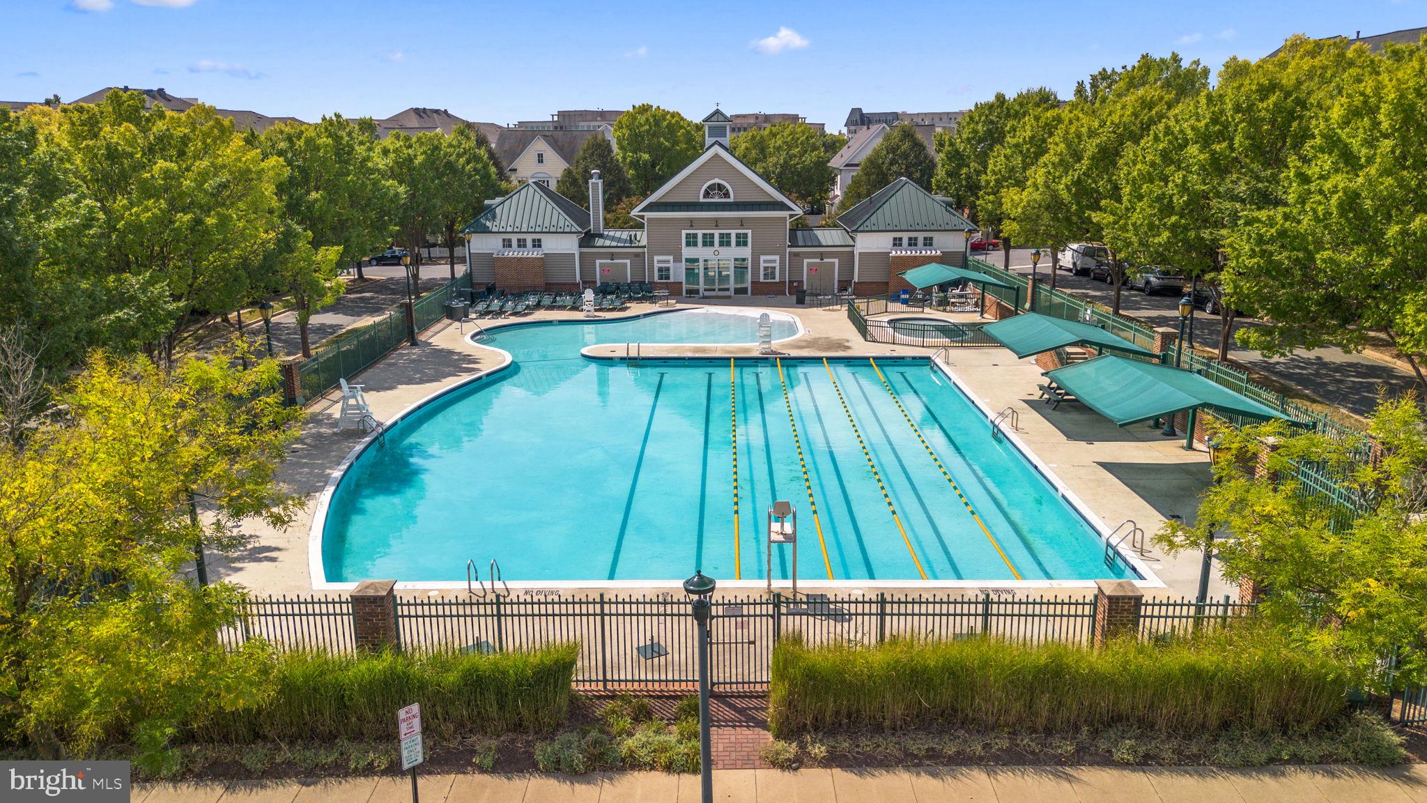 1222 Gaither Road Rockville, MD 20850 - Photo 29 of 42 an aerial view of a house with swimming pool and a yard