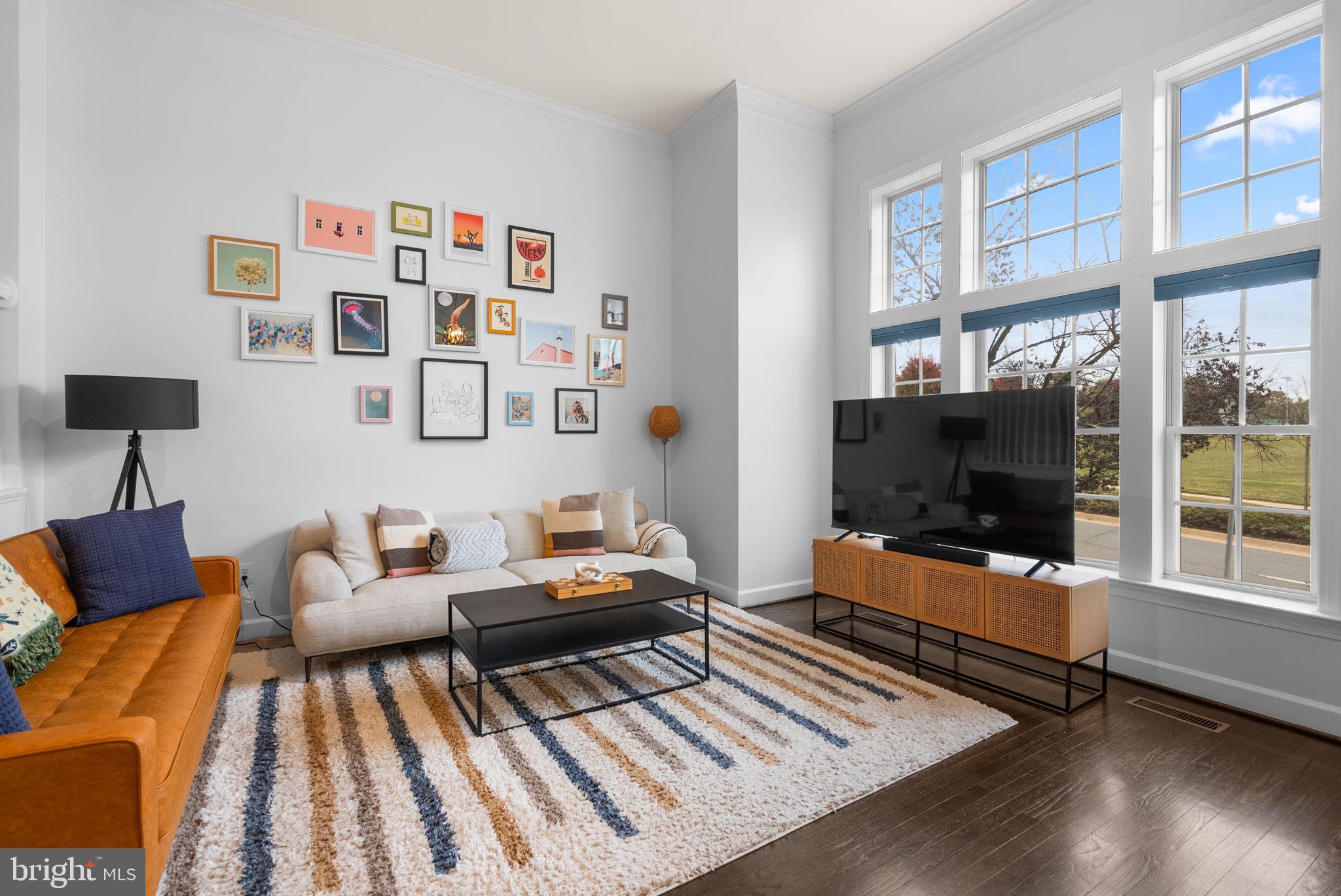 1222 Gaither Road Rockville, MD 20850 - Photo 3 of 42 a living room with furniture and a flat screen tv