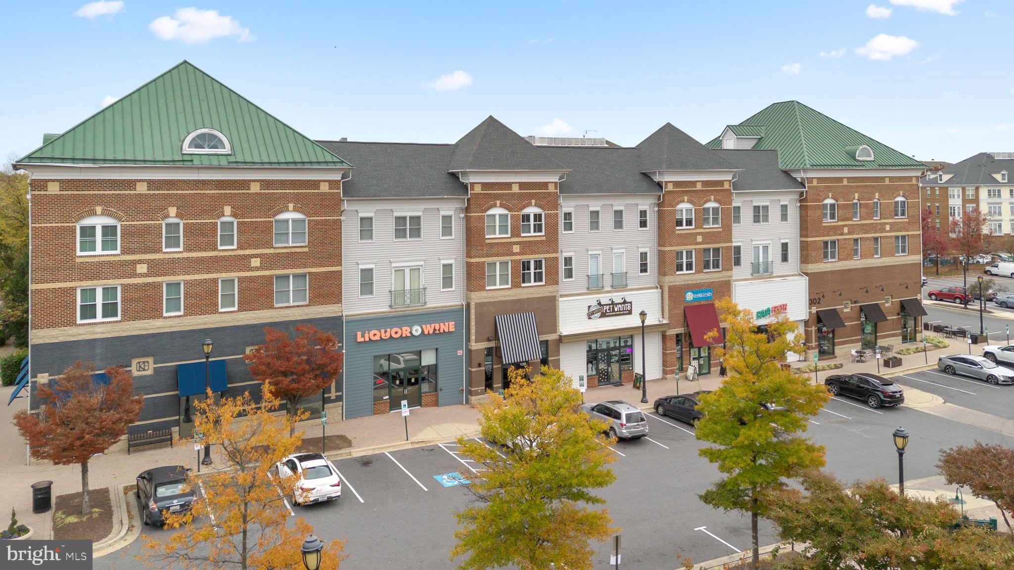 1222 Gaither Road Rockville, MD 20850 - Photo 36 of 42 a front view of a residential apartment building with a yard