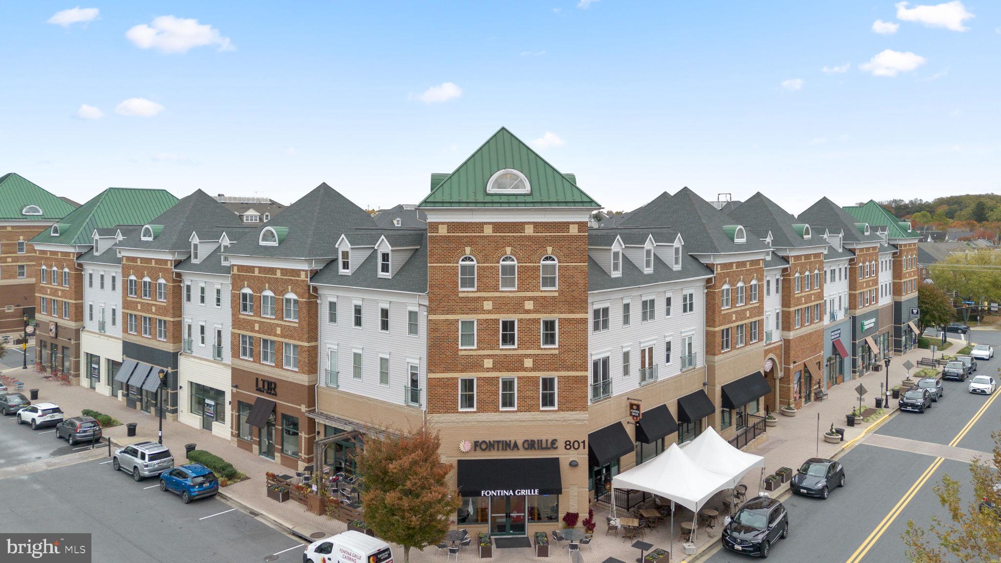 1222 Gaither Road Rockville, MD 20850 - Photo 38 of 42 a front view of a residential apartment building with a yard