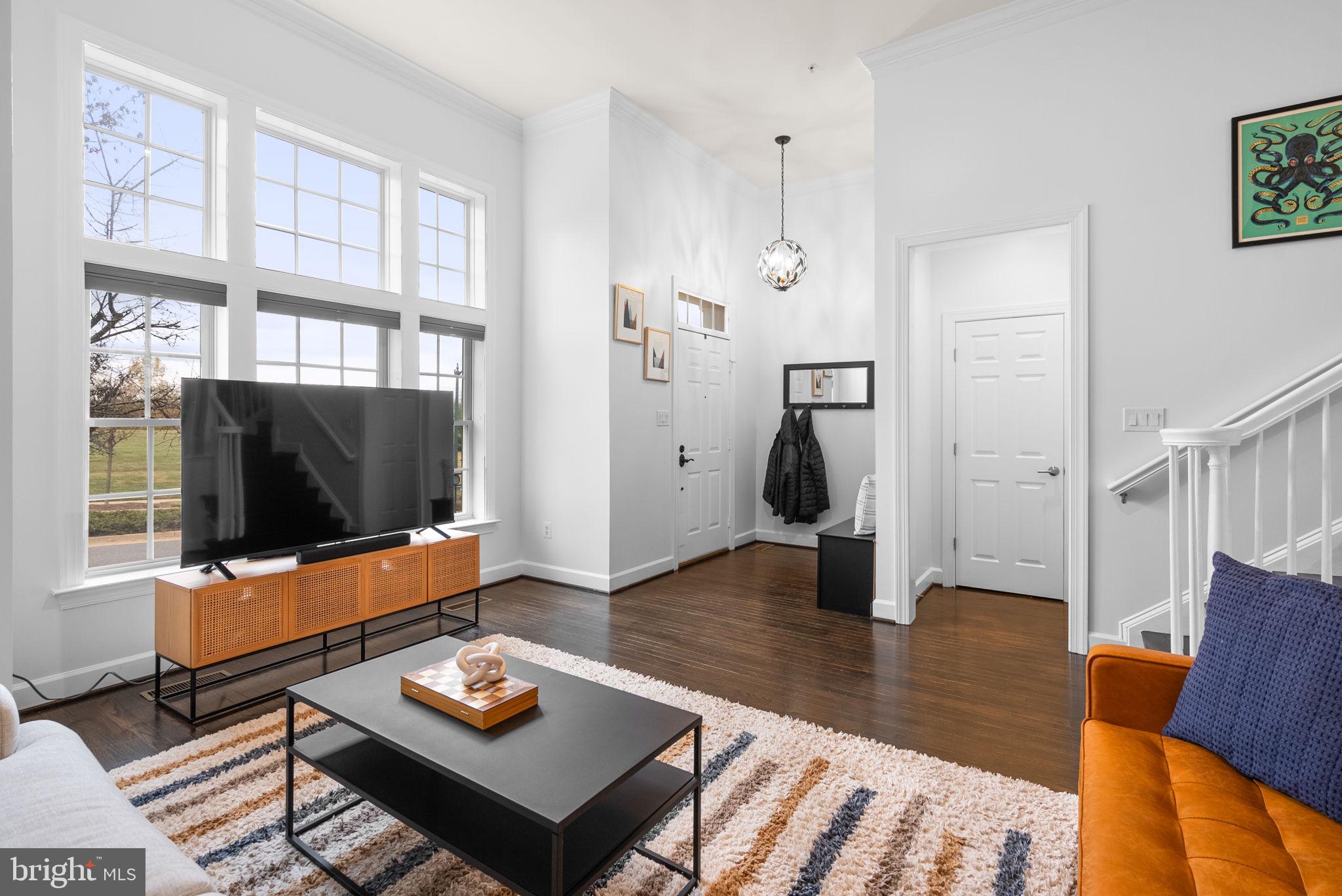1222 Gaither Road Rockville, MD 20850 - Photo 6 of 42 a living room with furniture and a flat screen tv