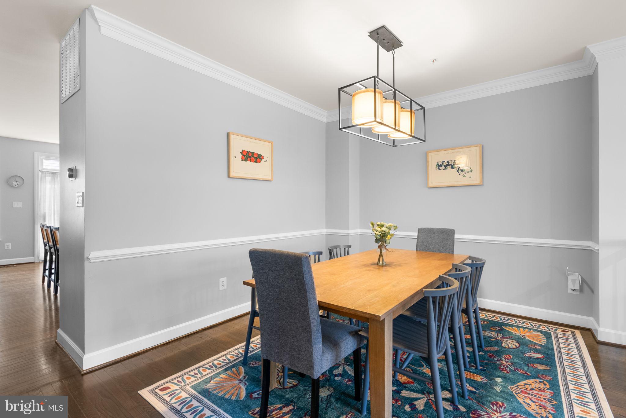 1222 Gaither Road Rockville, MD 20850 - Photo 7 of 42 a view of a dining room with furniture and a chandelier