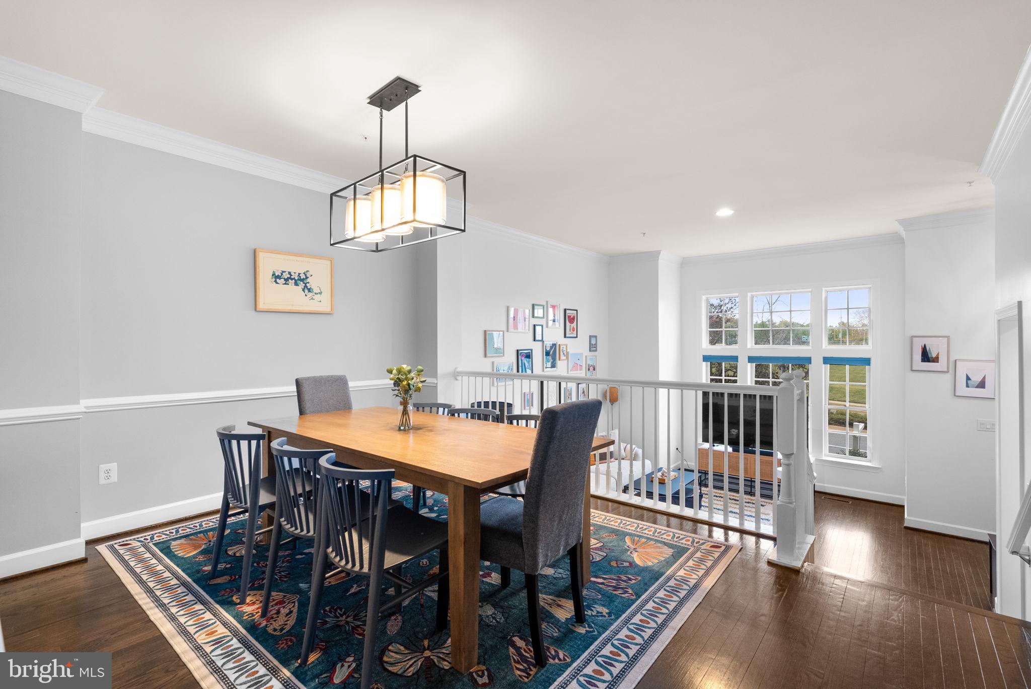 1222 Gaither Road Rockville, MD 20850 - Photo 8 of 42 a view of a dining room with furniture window and wooden floor