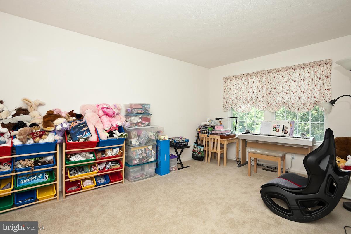 7519 Stream Crossing Road Baltimore, MD 21209 - Photo 12 of 16 a living room with furniture and a window