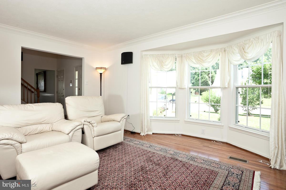 7519 Stream Crossing Road Baltimore, MD 21209 - Photo 3 of 16 a living room with furniture and a large window
