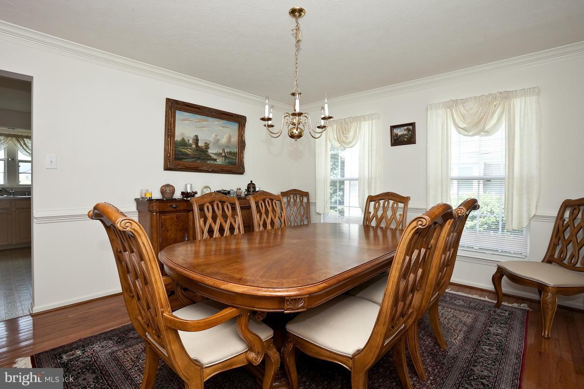 7519 Stream Crossing Road Baltimore, MD 21209 - Photo 4 of 16 a view of a dining room with furniture