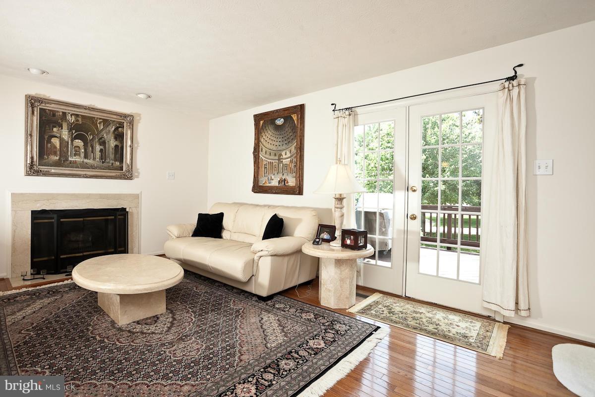 7519 Stream Crossing Road Baltimore, MD 21209 - Photo 8 of 16 a living room with furniture a rug and a window
