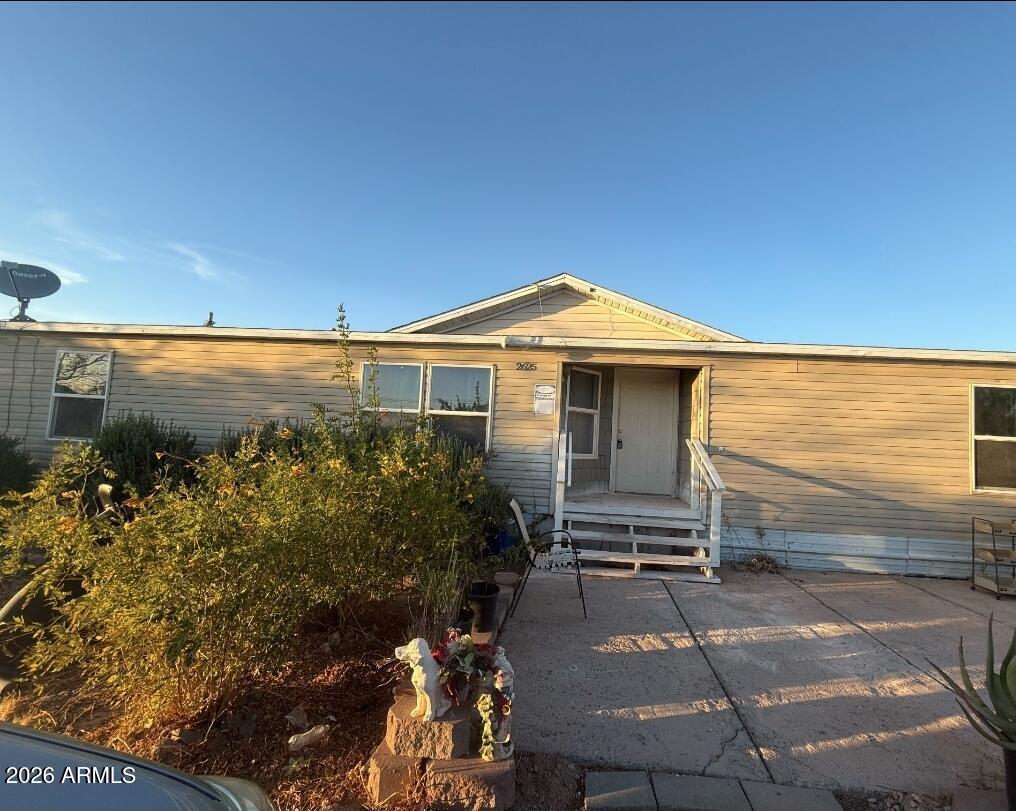 2625 Saddle Vista Road Tonopah, AZ 85354 - Photo 16 of 19 a front view of a house with a yard
