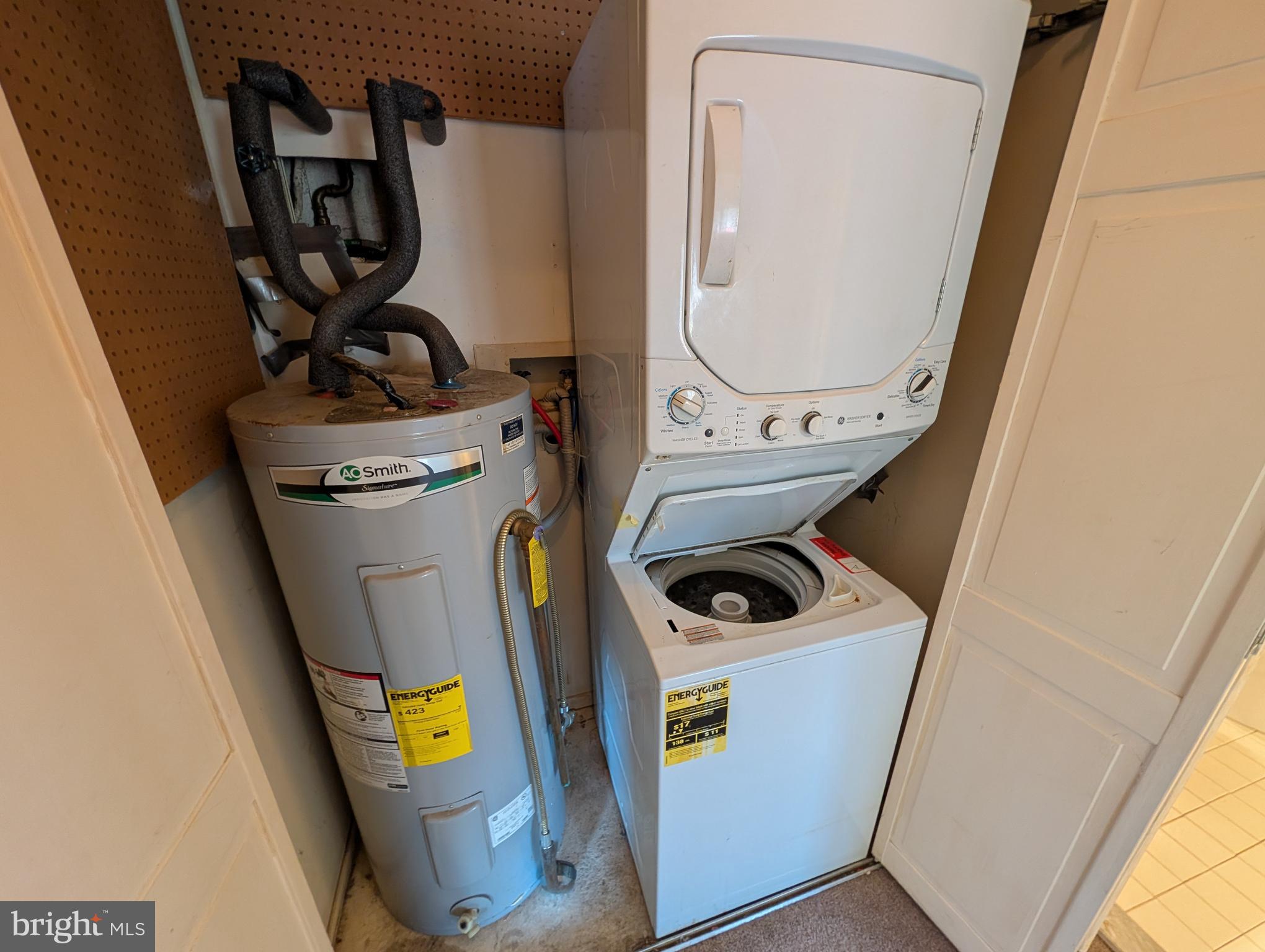 10028 Stedwick Road, Unit 10028 Gaithersburg, MD 20886 - Photo 15 of 19 Hot water tank and included Washer/Dryer