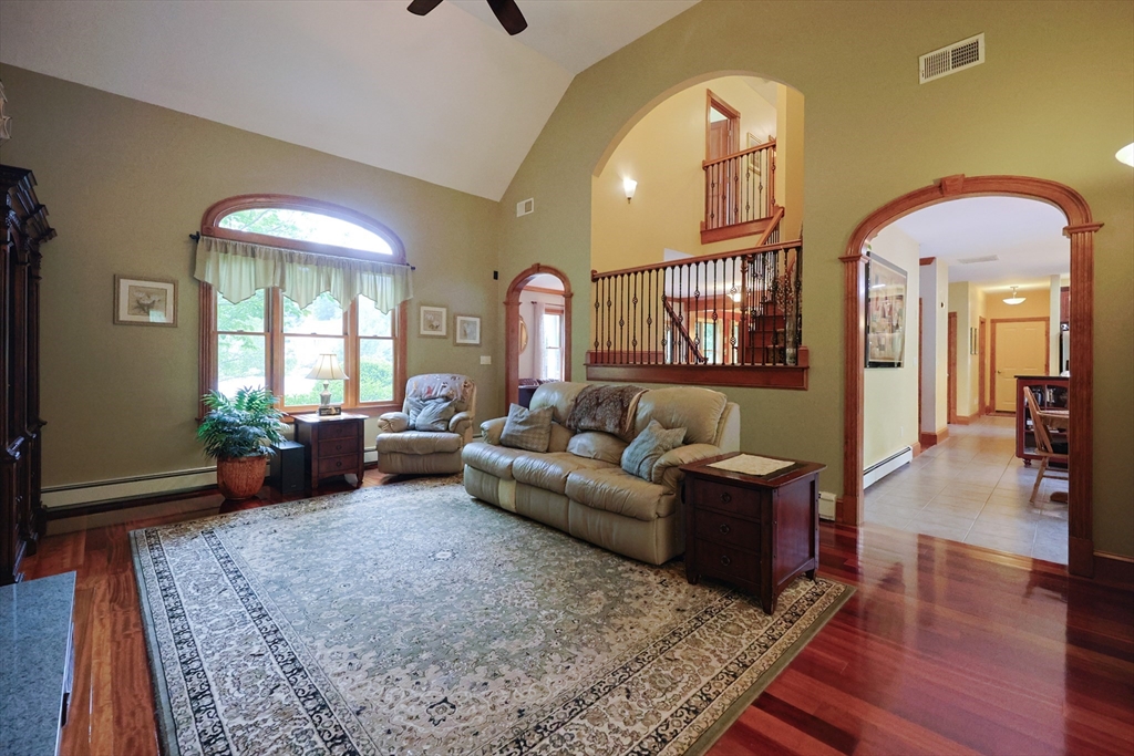 70 Azalea Way Hanson, MA 02341 - Photo 13 of 42 a living room with furniture and a couch