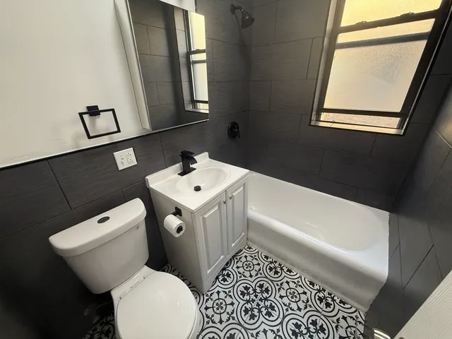 a bathroom with a toilet a sink and a bathtub