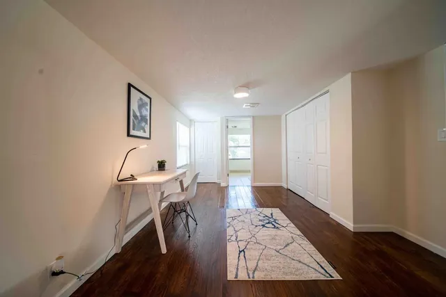 a workspace with furniture and wooden floor