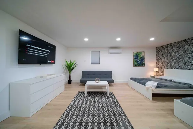 a living room with furniture and a rug