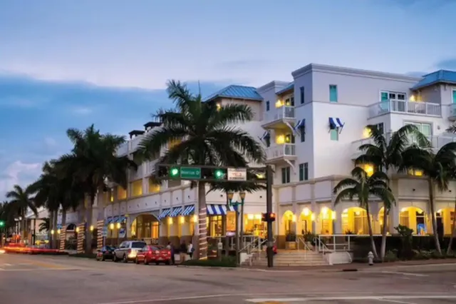 a view of street along with palm trees
