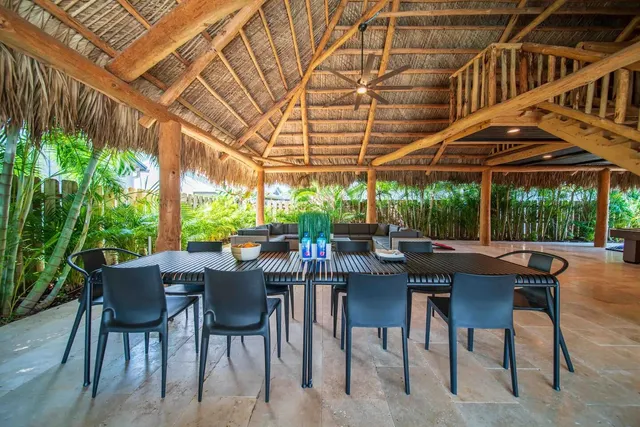 a view of a backyard with table and chairs