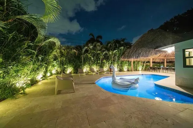 a view of a swimming pool with an outdoor space and seating area