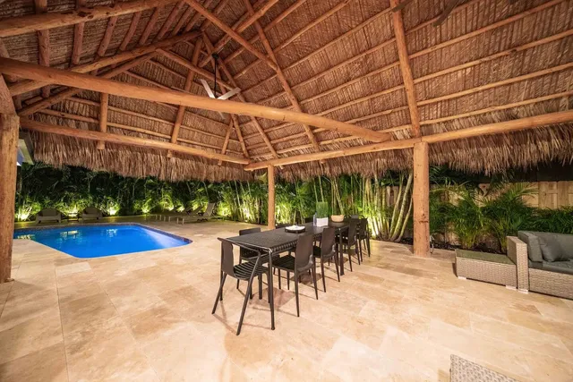 a view of a swimming pool with a patio