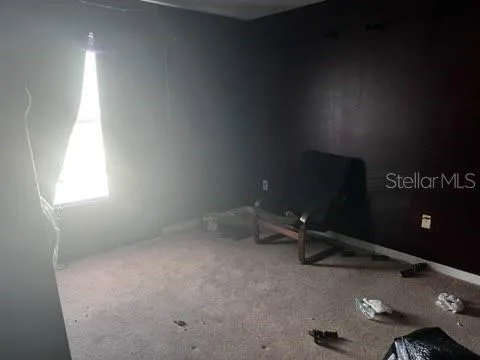 a room with gym equipment and a window