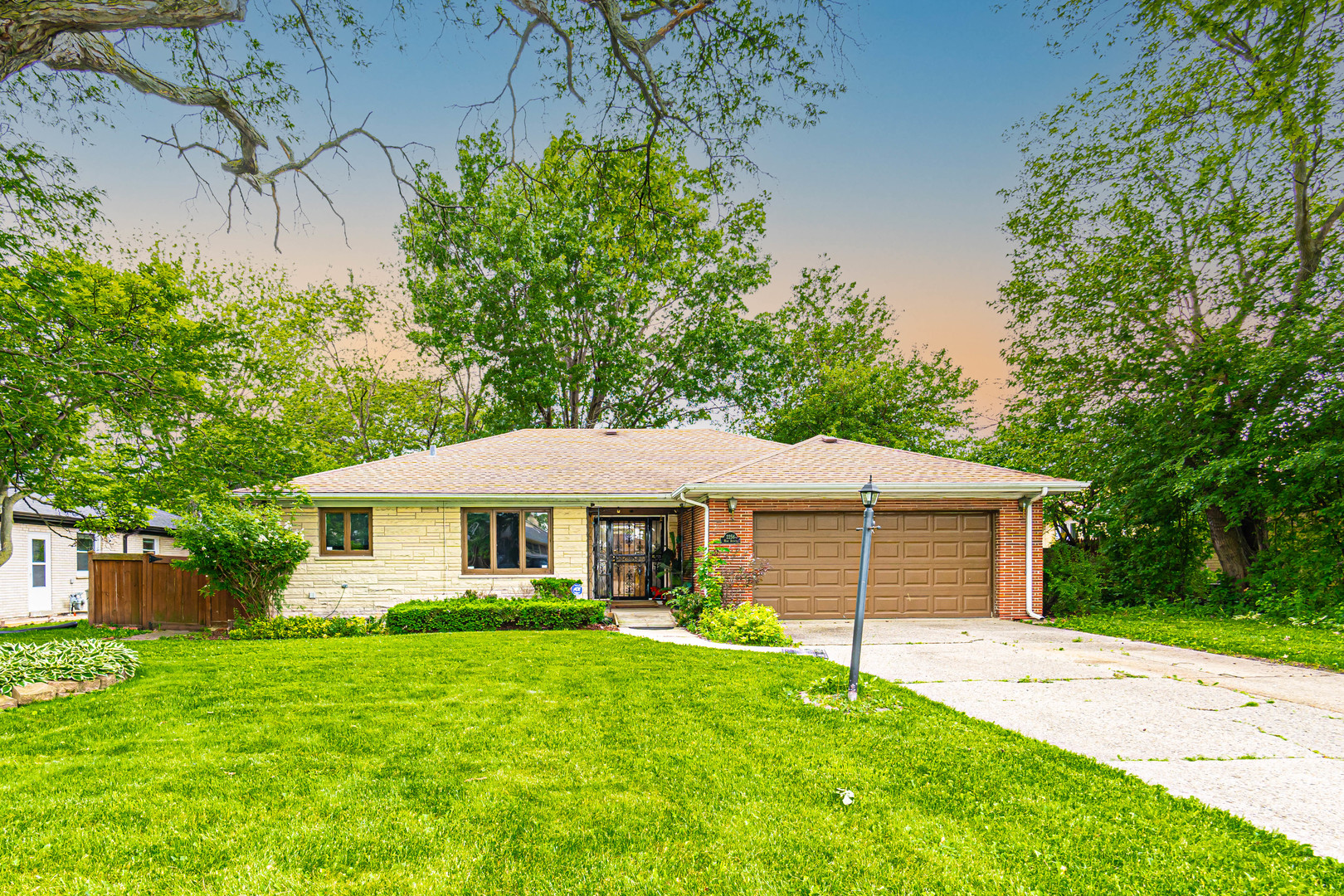 2256 North Home Avenue Park Ridge, IL 60068 - Photo 1 of 40 a front view of a house with a garden