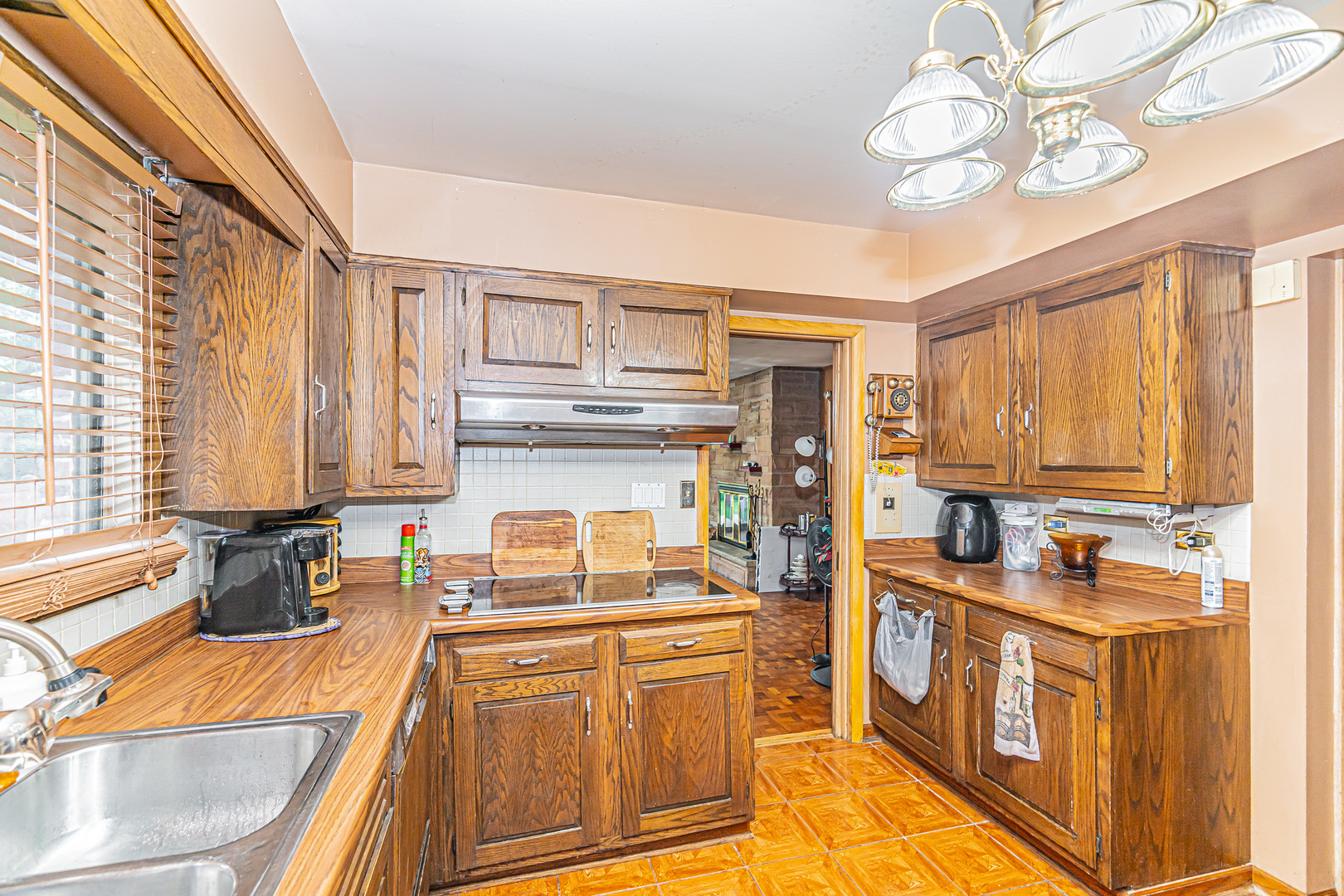 2256 North Home Avenue Park Ridge, IL 60068 - Photo 11 of 40 a kitchen with stainless steel appliances granite countertop a stove a sink and a refrigerator