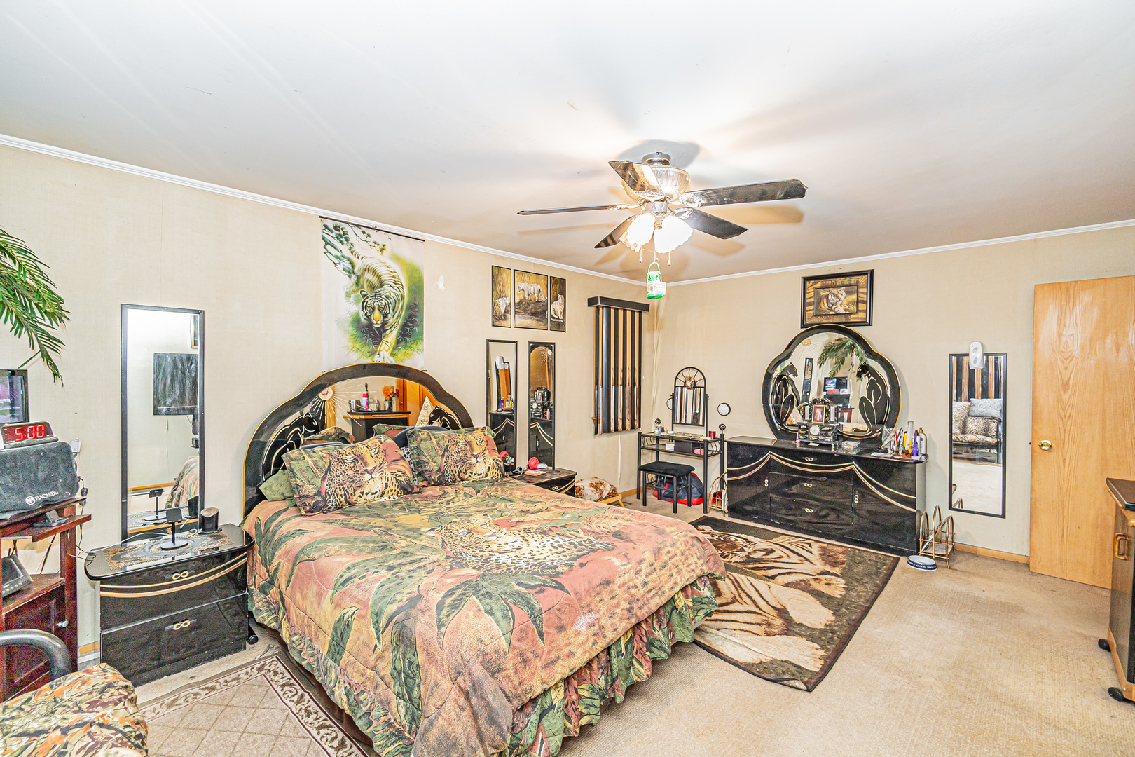 2256 North Home Avenue Park Ridge, IL 60068 - Photo 25 of 40 a bedroom with a bed and a chandelier