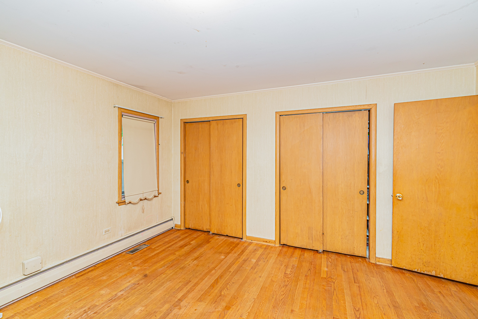 2256 North Home Avenue Park Ridge, IL 60068 - Photo 6 of 40 wooden floor in an empty room with a window